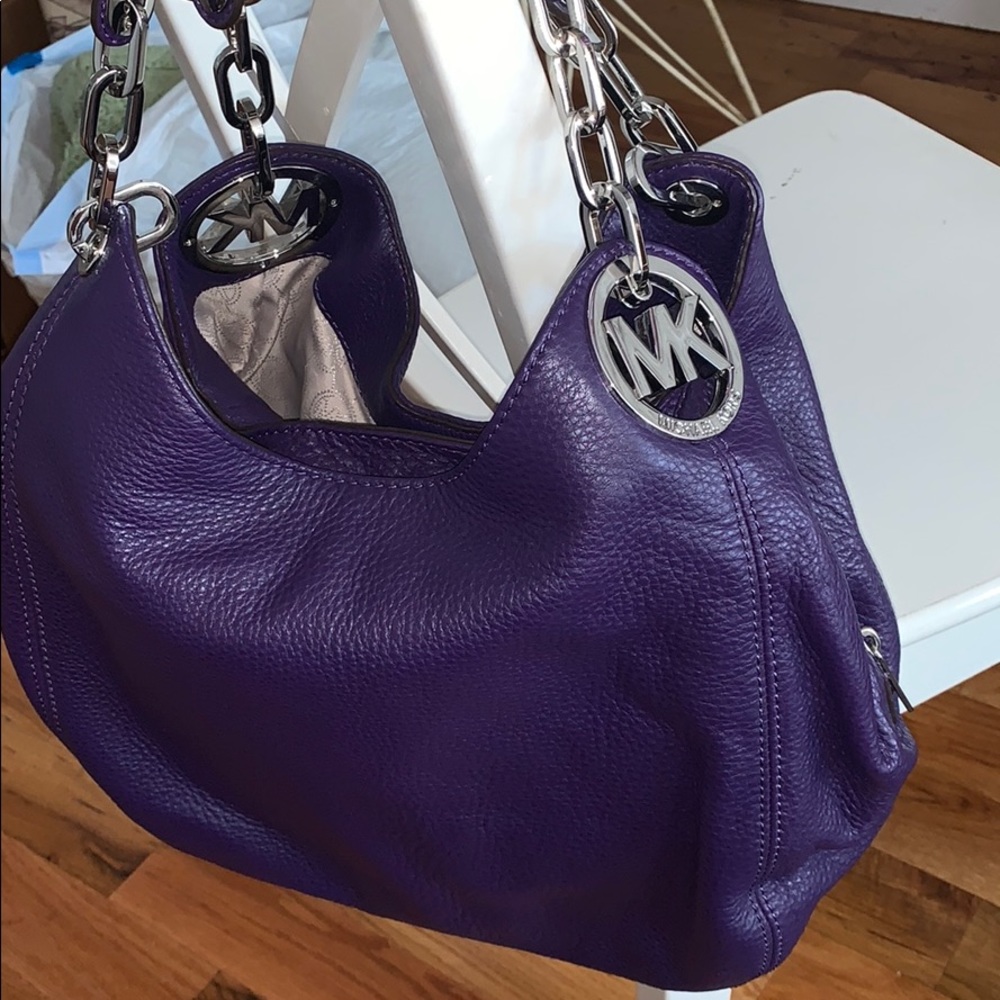 Brand new purple Micheal Khors purse in the bag!